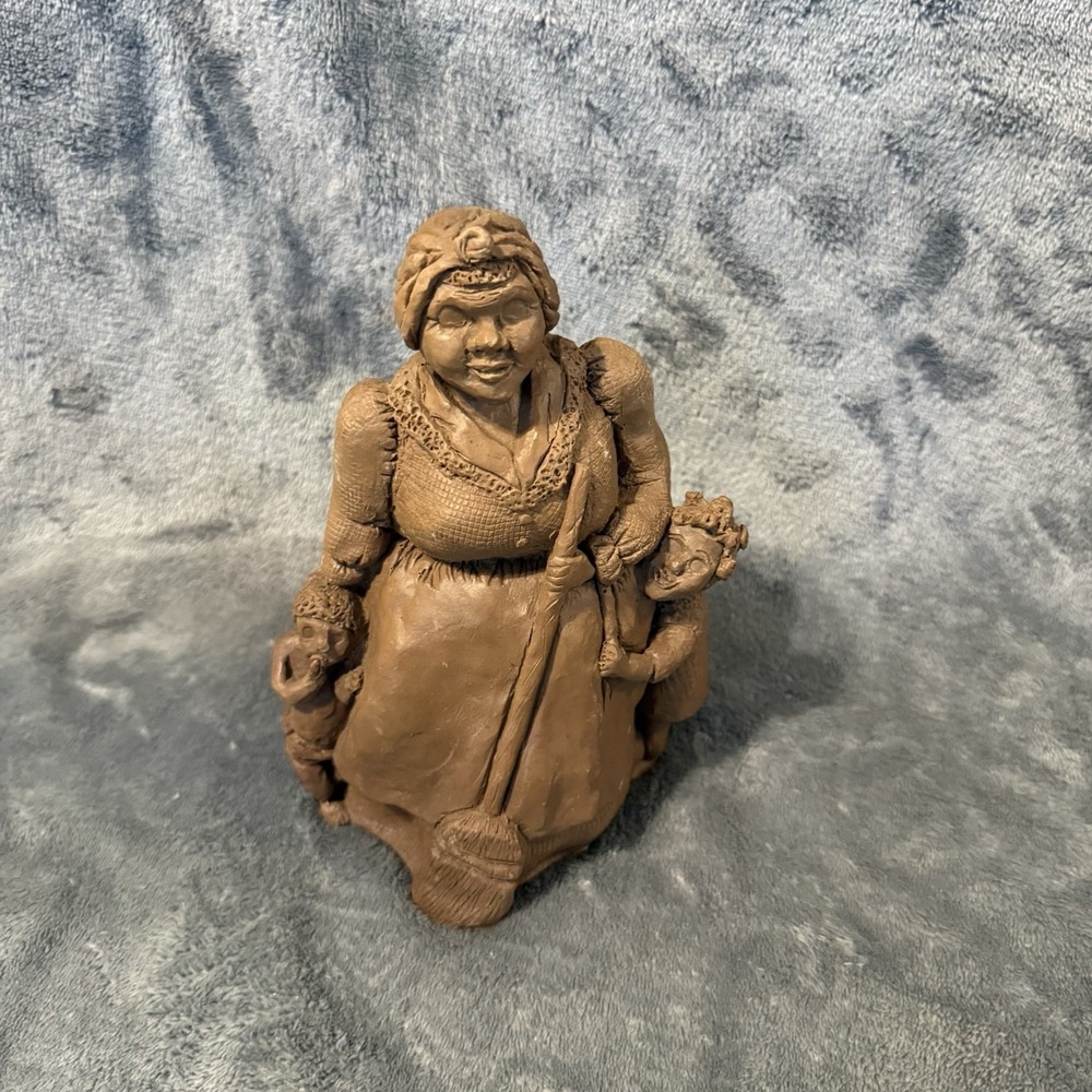 decorative clay figurine depicting a woman with two children